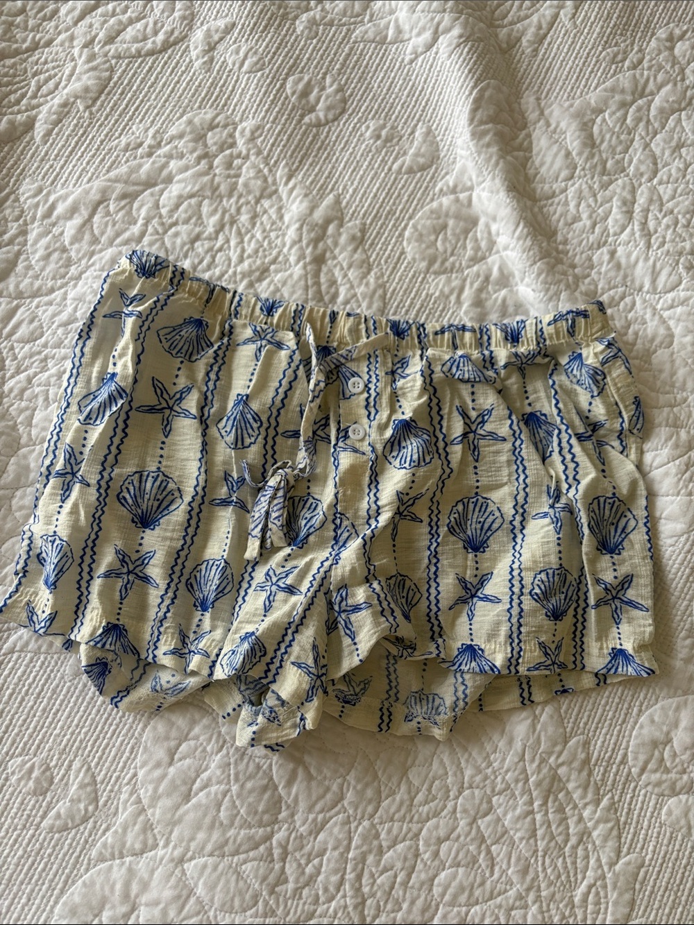 SHEIN Cream Shorts with Blue Seashell Print